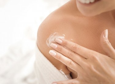 Woman applying cream